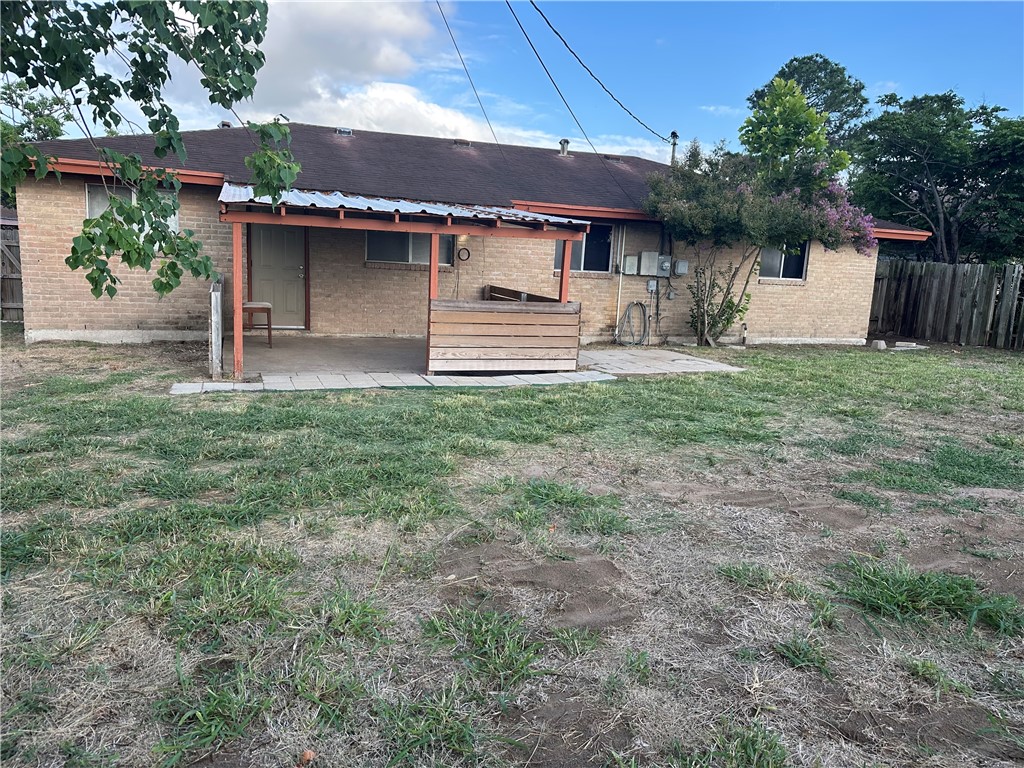 1041 Comal Street Corpus Christi, TX 78407 - Photo 12 of 12 a front view of a house with a garden