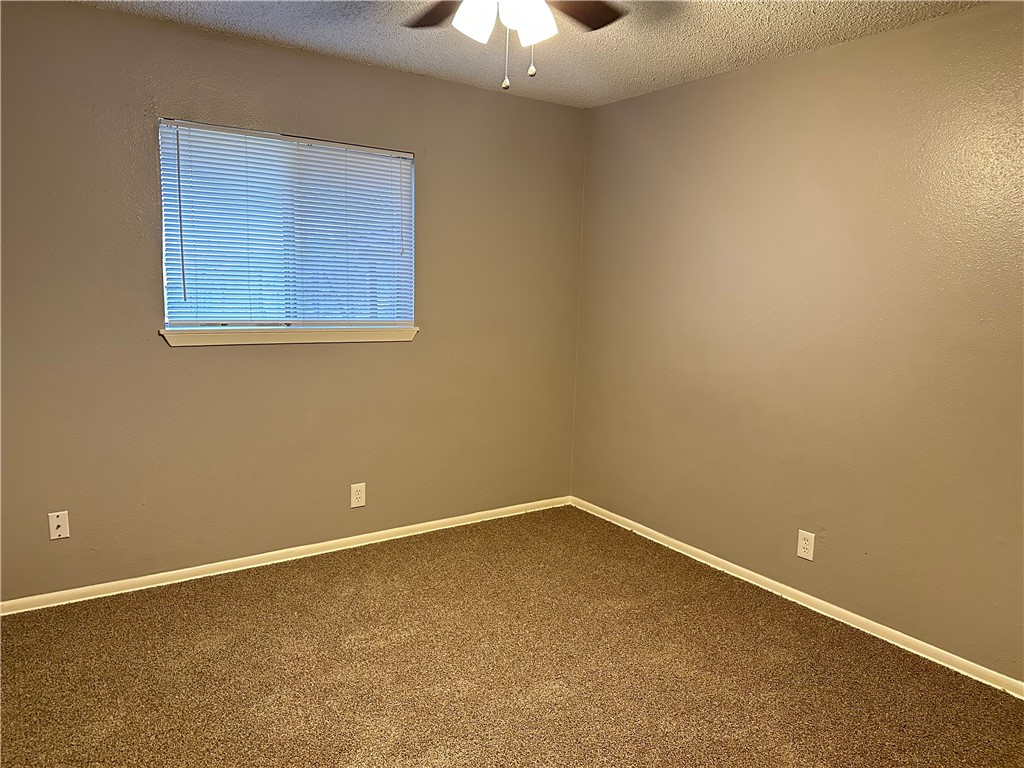 1041 Comal Street Corpus Christi, TX 78407 - Photo 5 of 12 an empty room with a window