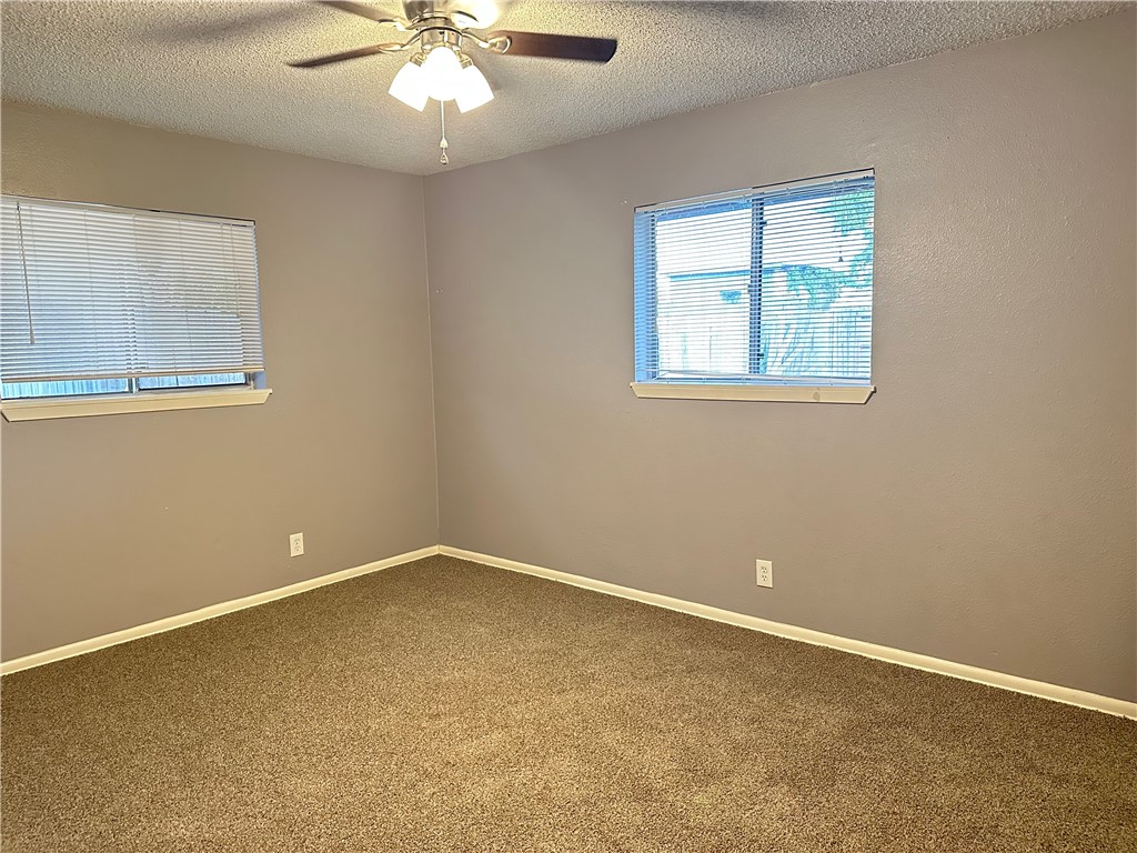 1041 Comal Street Corpus Christi, TX 78407 - Photo 6 of 12 an empty room with a window