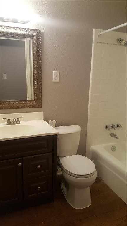 1041 Comal Street Corpus Christi, TX 78407 - Photo 8 of 12 a bathroom with a sink a toilet and shower