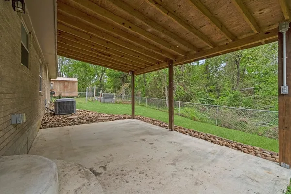 a view of a patio with wooden floor
