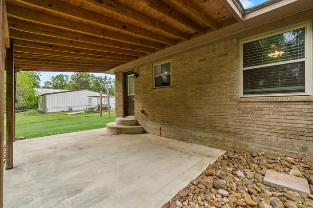 a view of a backyard with a grill