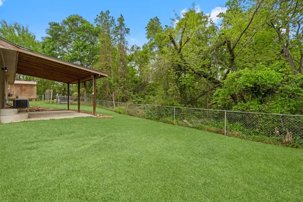 a backyard of a house with lots of green space