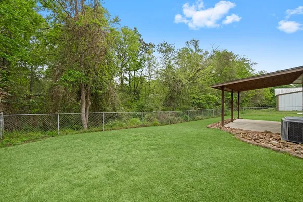 a backyard of a house with lots of green space