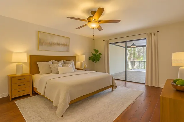 a bathroom with a granite countertop sink a toilet and shower