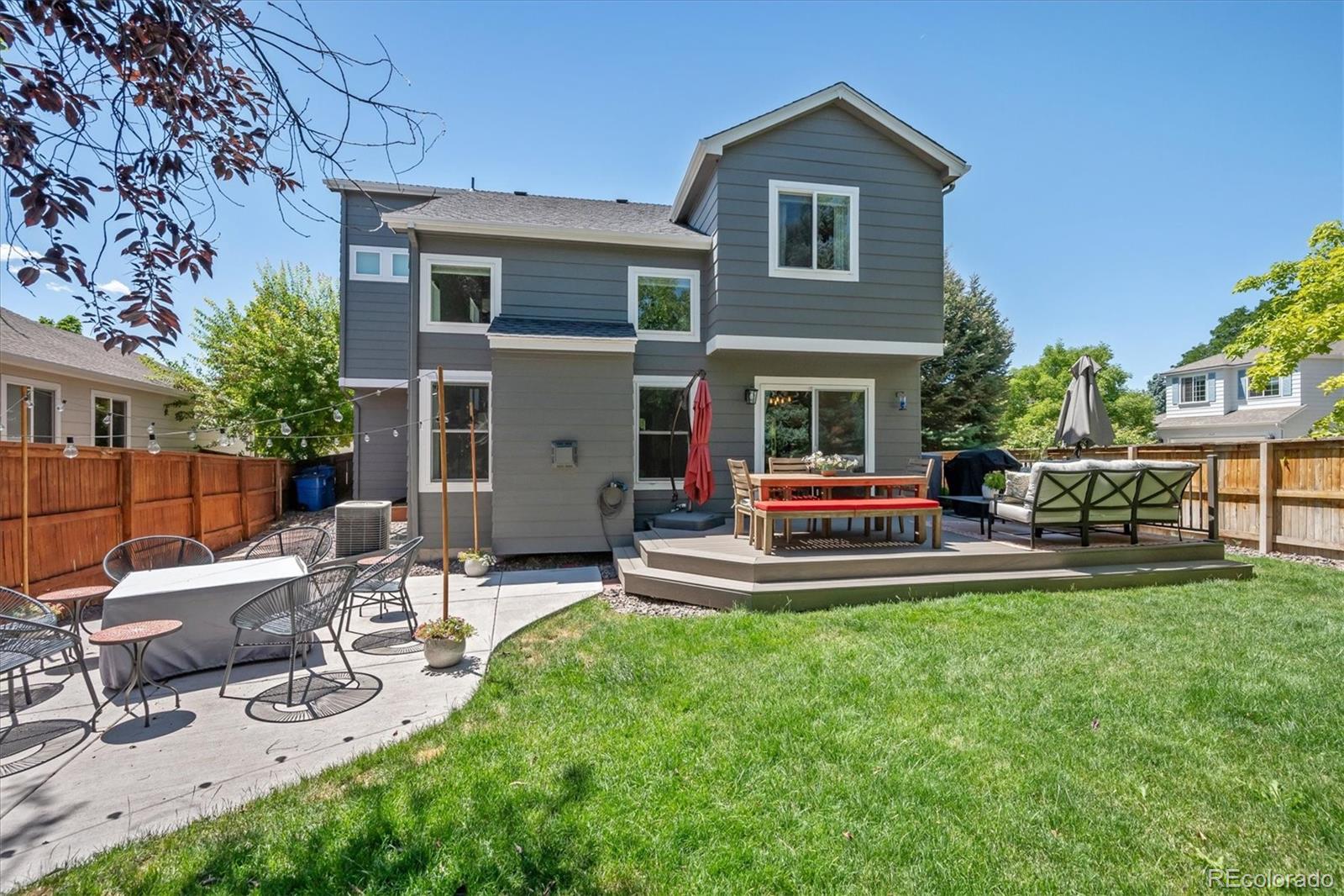 9662 Rockhampton Way Highlands Ranch, CO 80130 - Photo 4 of 37 a view of a house with a yard and sitting area