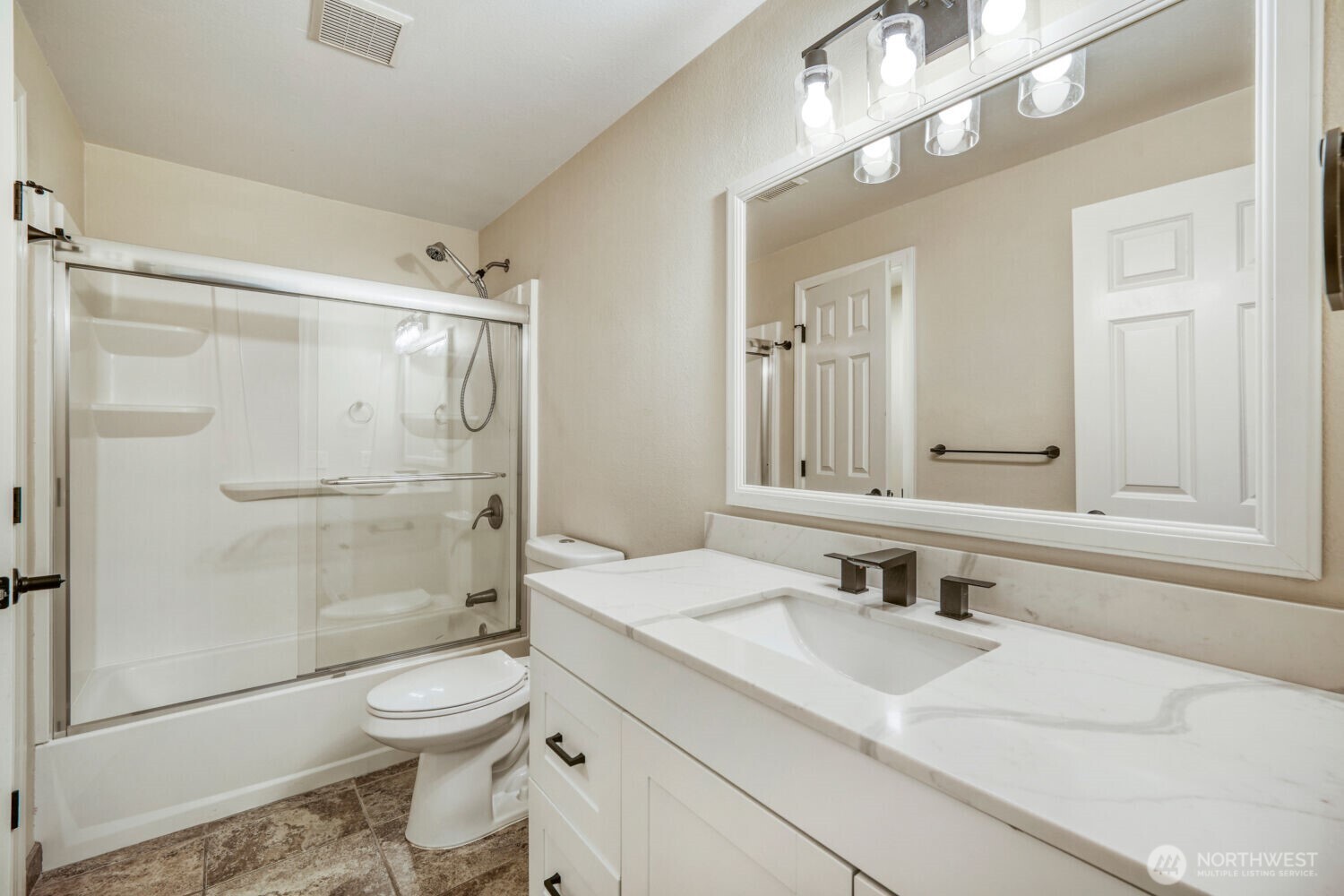 3618 South 243rd Street Kent, WA 98032 - Photo 12 of 37 a bathroom with a sink a toilet and shower