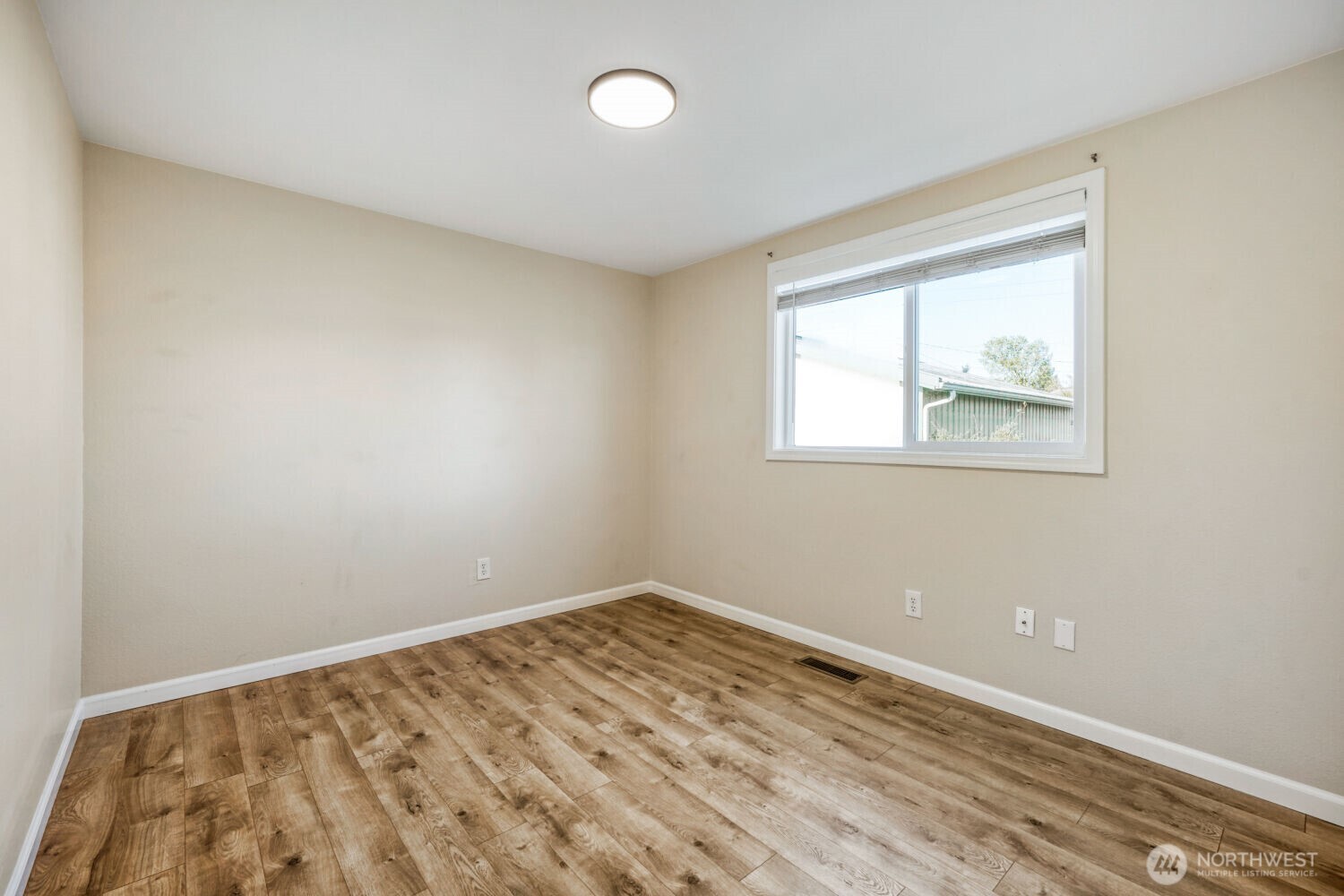 3618 South 243rd Street Kent, WA 98032 - Photo 14 of 37 an empty room with a window