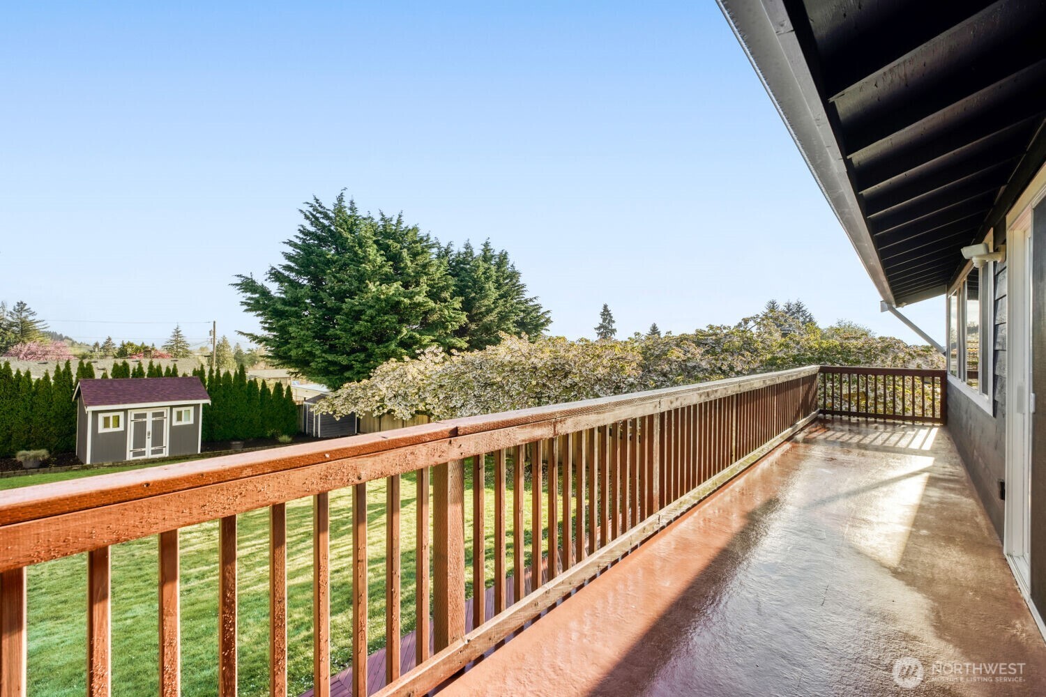 3618 South 243rd Street Kent, WA 98032 - Photo 15 of 37 a view of a balcony with wooden floor and fence