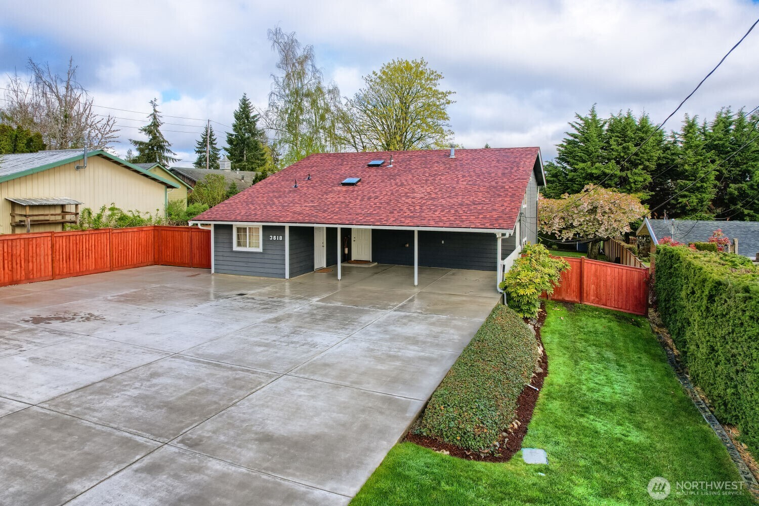 3618 South 243rd Street Kent, WA 98032 - Photo 2 of 37 a front view of a house with a yard and trees