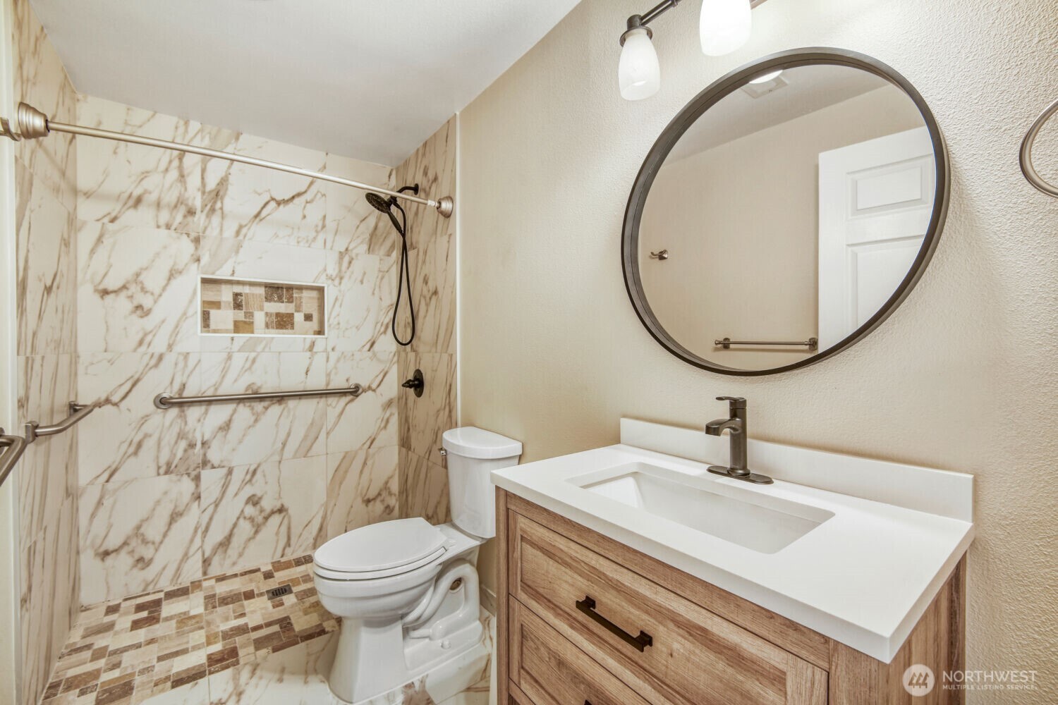 3618 South 243rd Street Kent, WA 98032 - Photo 21 of 37 a bathroom with a sink a toilet and a mirror
