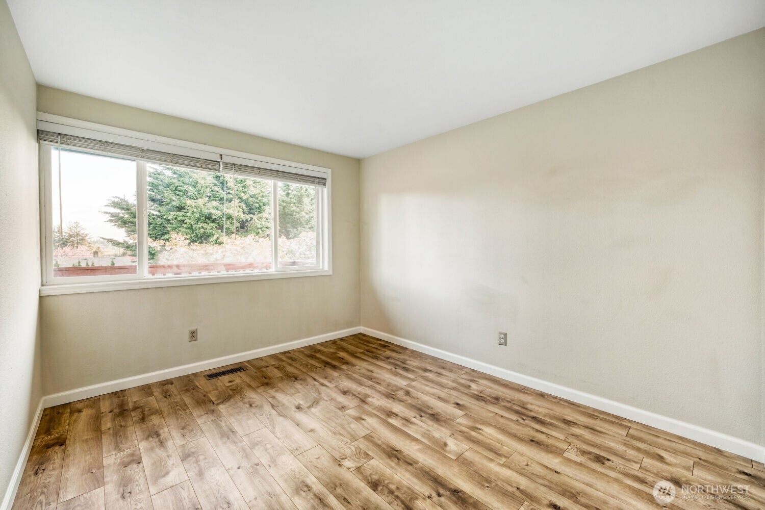 3618 South 243rd Street Kent, WA 98032 - Photo 10 of 37 a view of a room with wooden floor and a window