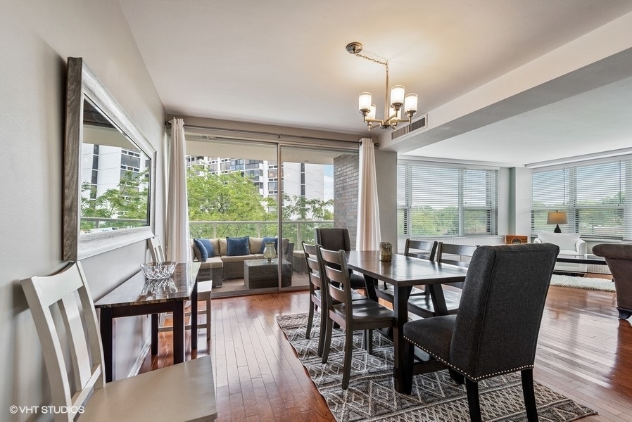 1616 Sheridan Road, Unit 5H Wilmette, IL 60091 - Photo 11 of 26 a view of a dining room with furniture window and outside view