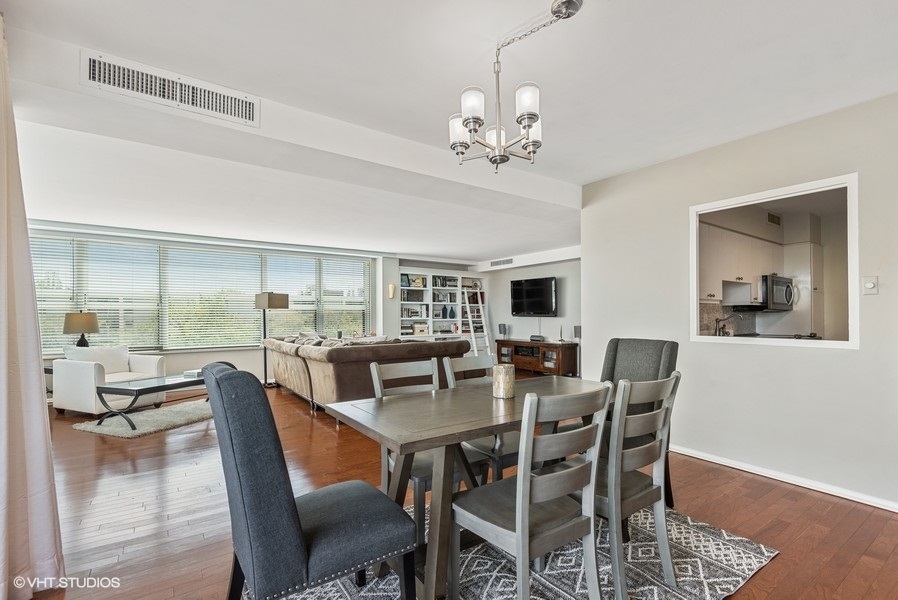 1616 Sheridan Road, Unit 5H Wilmette, IL 60091 - Photo 12 of 26 a view of a dining room with furniture window and outside view