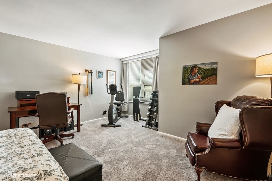 1616 Sheridan Road, Unit 5H Wilmette, IL 60091 - Photo 14 of 26 a view of a livingroom with workspace and a couch