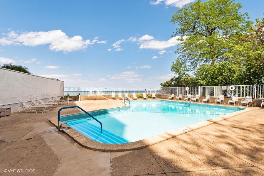 1616 Sheridan Road, Unit 5H Wilmette, IL 60091 - Photo 21 of 26 a view of a swimming pool with an outdoor space and seating area
