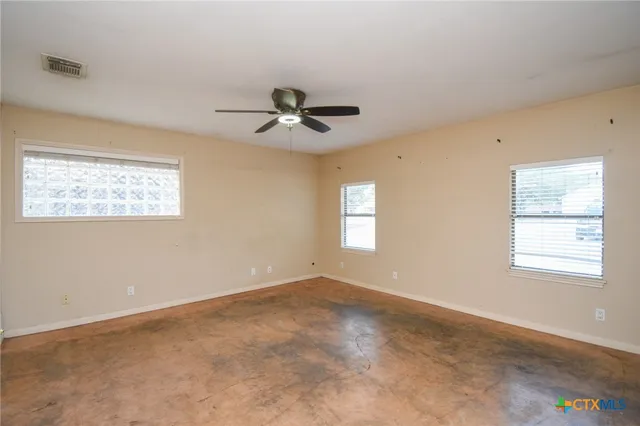 a bathroom with a sink toilet and mirror
