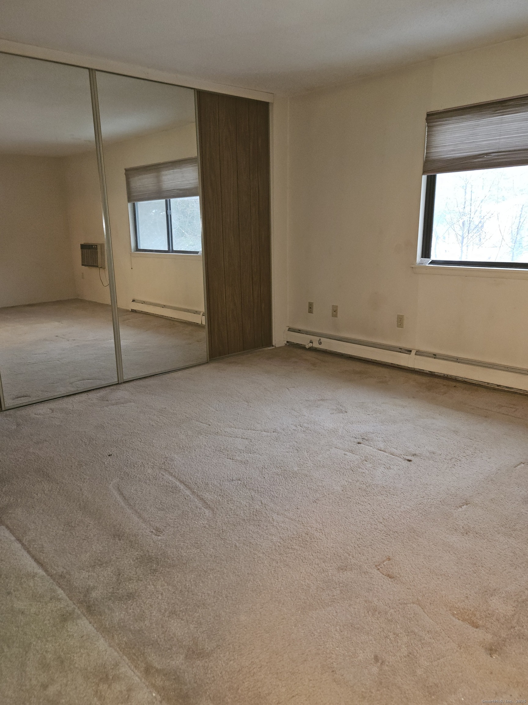38 Sutton Place, Unit 38 Bloomfield, CT 06002 - Photo 11 of 17 an empty room with a empty space and windows