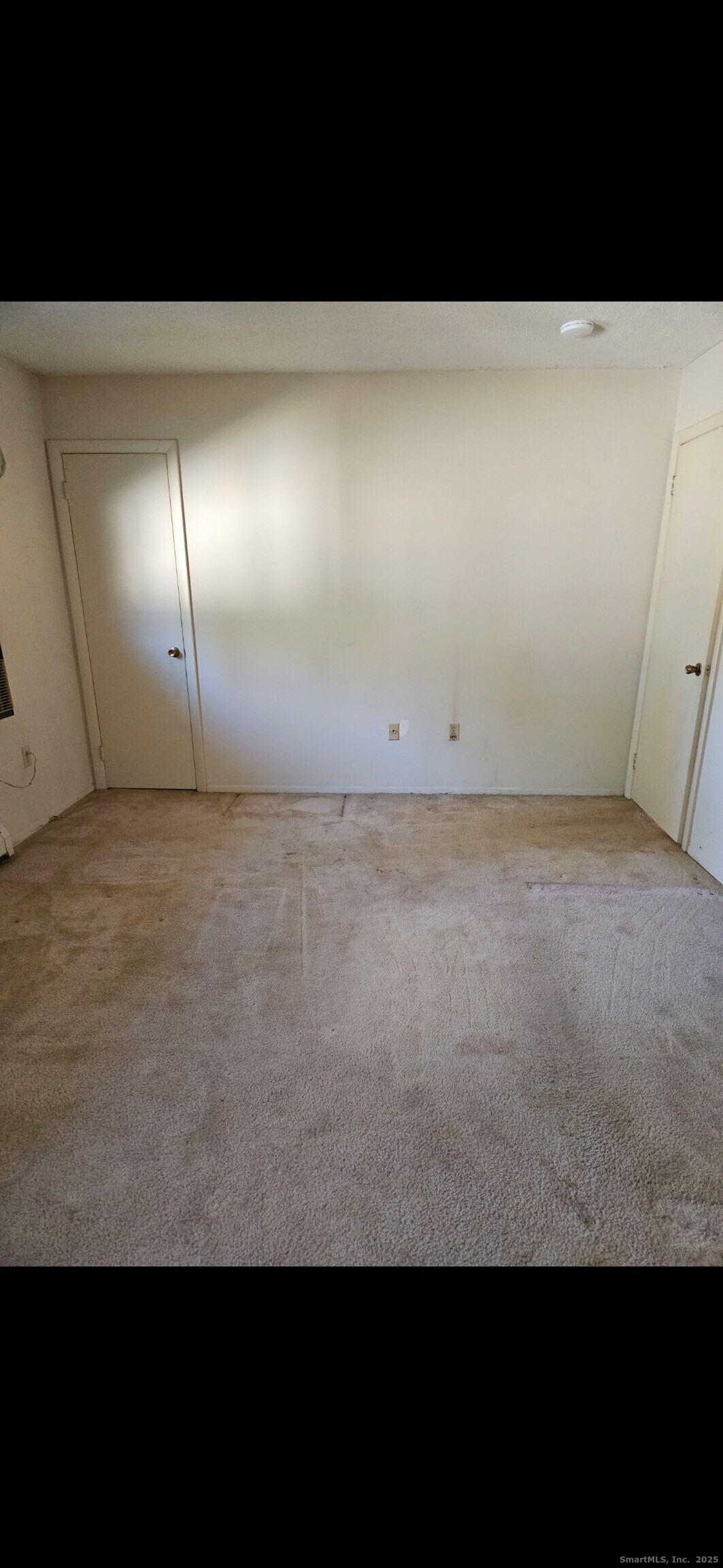 38 Sutton Place, Unit 38 Bloomfield, CT 06002 - Photo 12 of 17 a view of a room with an empty space