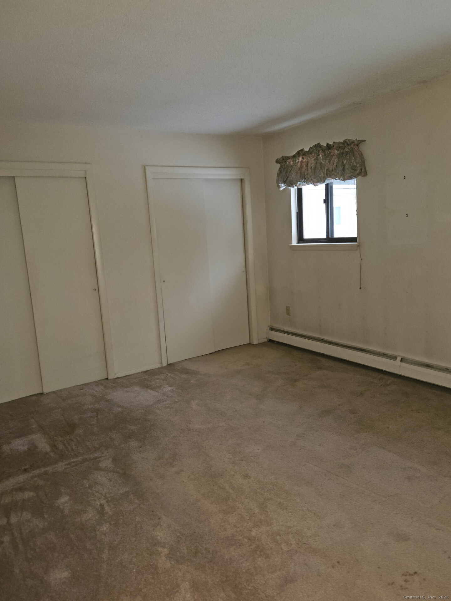 38 Sutton Place, Unit 38 Bloomfield, CT 06002 - Photo 13 of 17 a view of an empty room and window