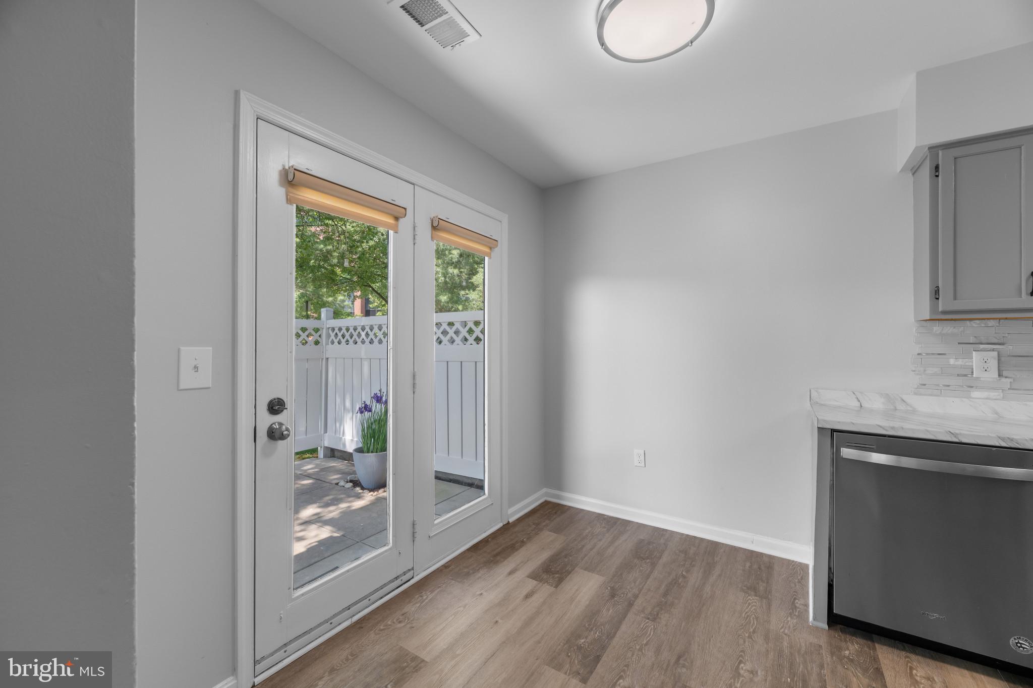 9302 Player Drive, Unit 155 Laurel, MD 20708 - Photo 15 of 43 a view of a room with wooden floor and window