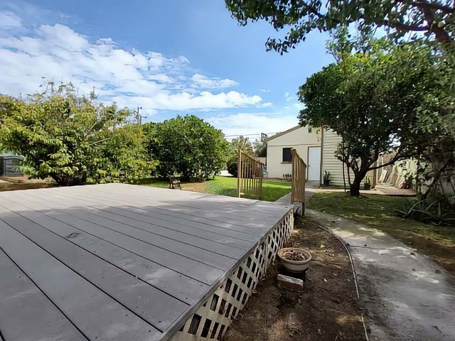 a view of a backyard with sitting area