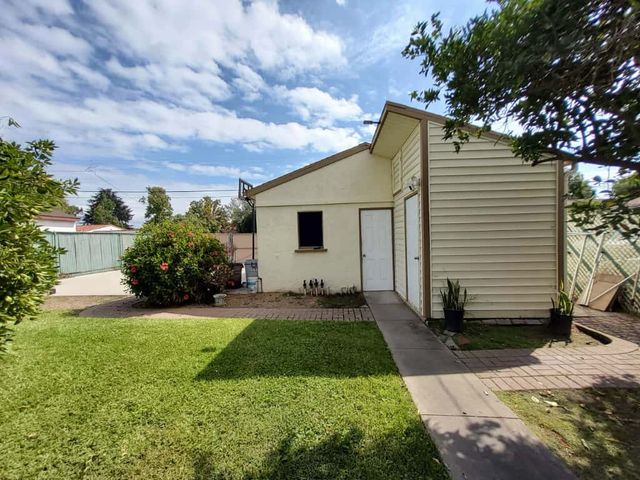a view of a backyard with a garden