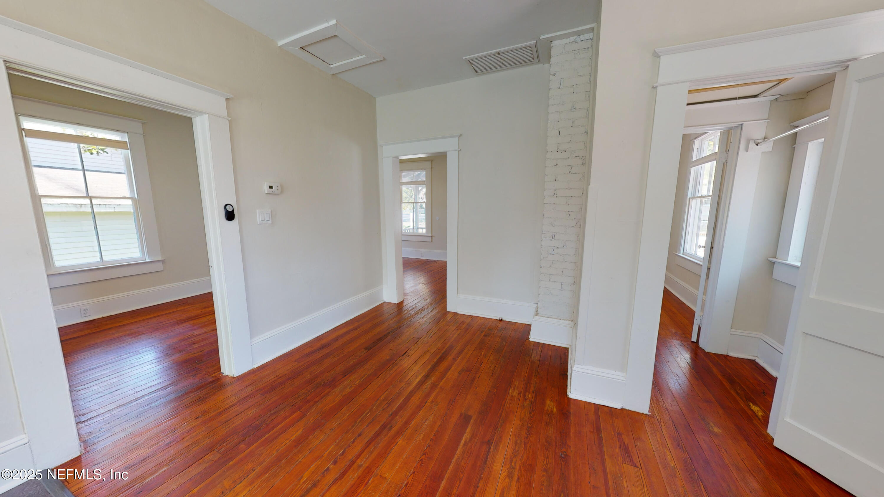11 Hildreth Drive St. Augustine, FL 32084 - Photo 17 of 25 wooden floor in an empty room with a window