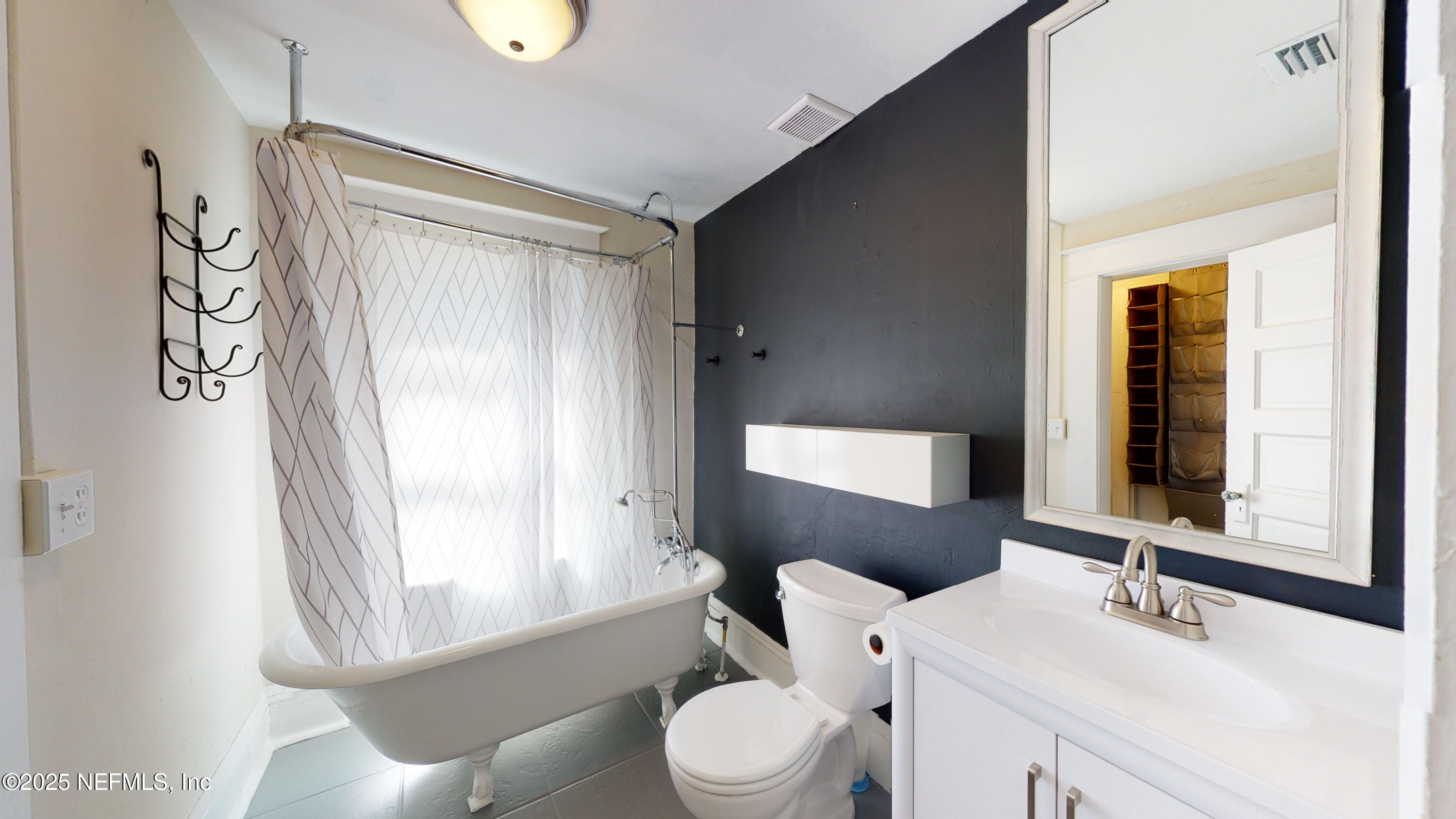 11 Hildreth Drive St. Augustine, FL 32084 - Photo 18 of 25 a bathroom with a toilet a sink and a mirror