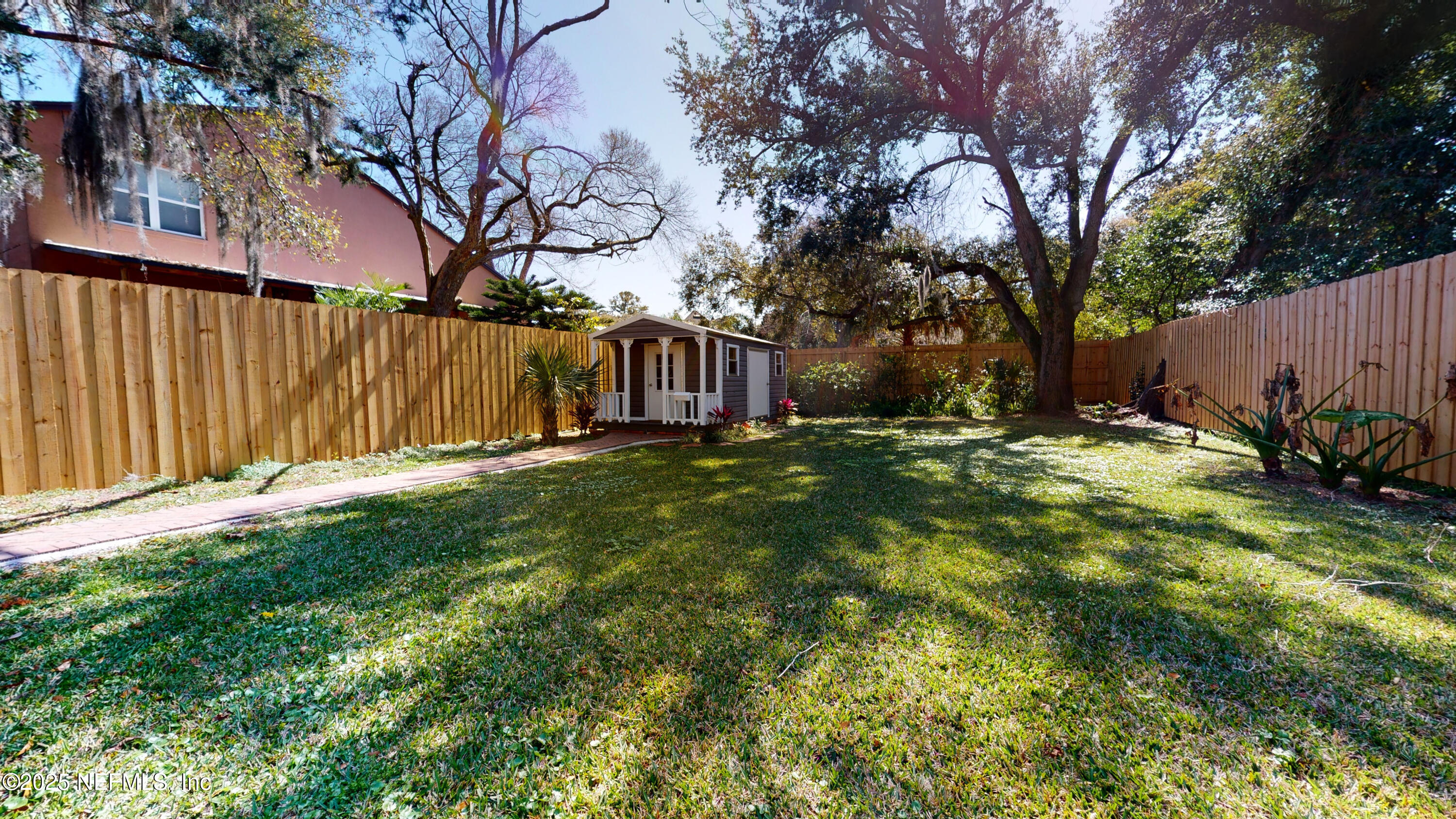 11 Hildreth Drive St. Augustine, FL 32084 - Photo 24 of 25 a view of yard with large trees and a barn in it
