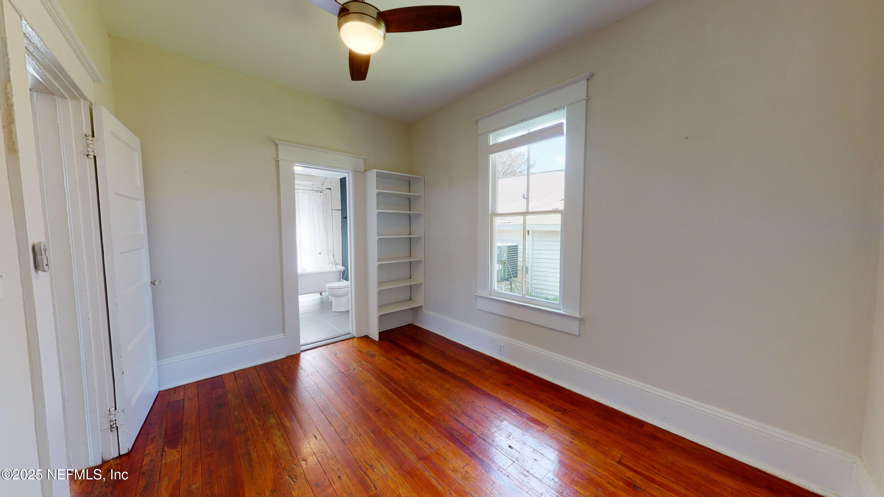 11 Hildreth Drive St. Augustine, FL 32084 - Photo 4 of 25 an empty room with wooden floor cabinet and windows