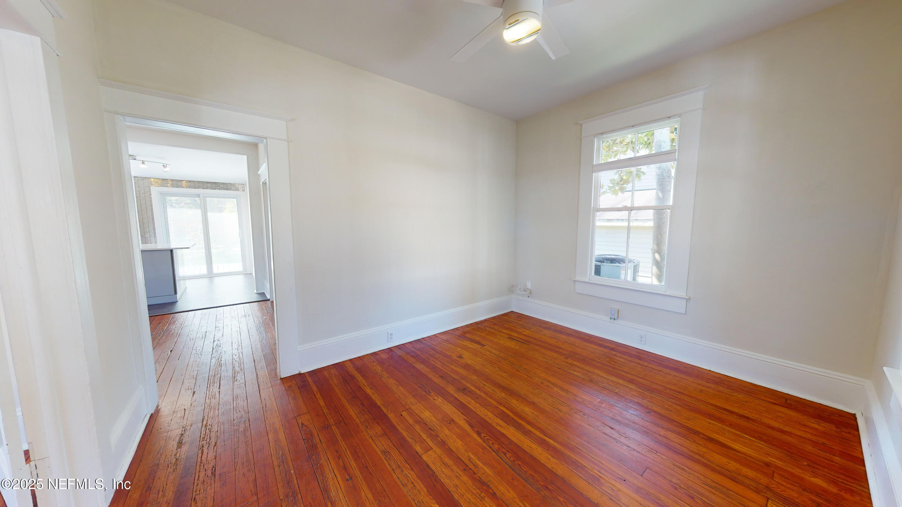 11 Hildreth Drive St. Augustine, FL 32084 - Photo 7 of 25 an empty room with wooden floor and windows
