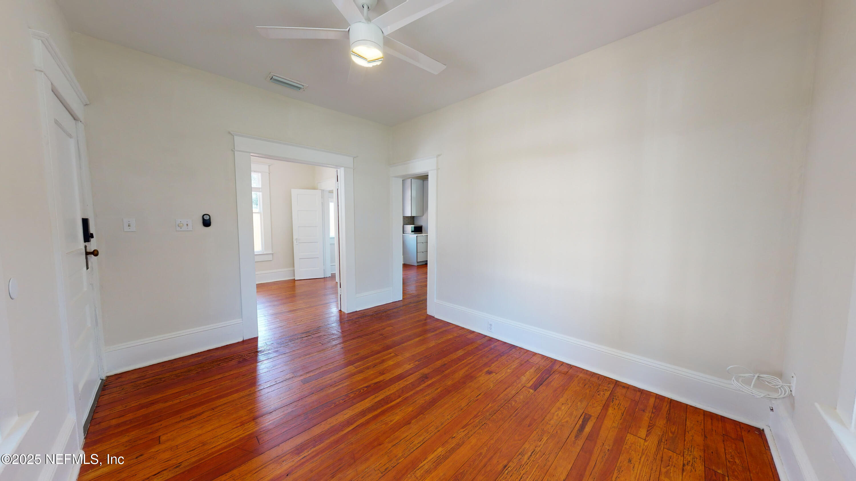 11 Hildreth Drive St. Augustine, FL 32084 - Photo 8 of 25 a view of an empty room with wooden floor