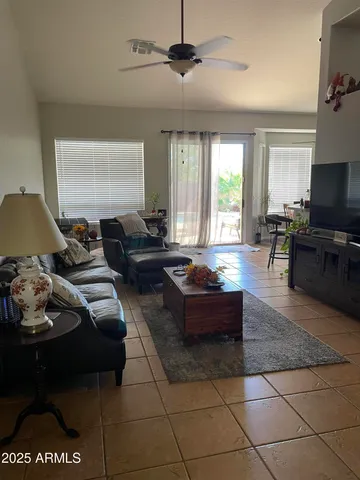 a living room with couch and a flat screen tv