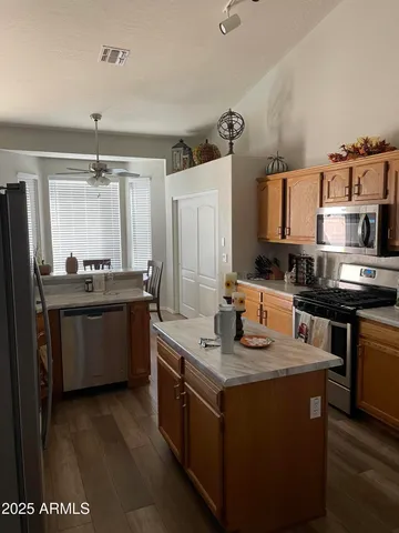 a kitchen with a sink stove and refrigerator