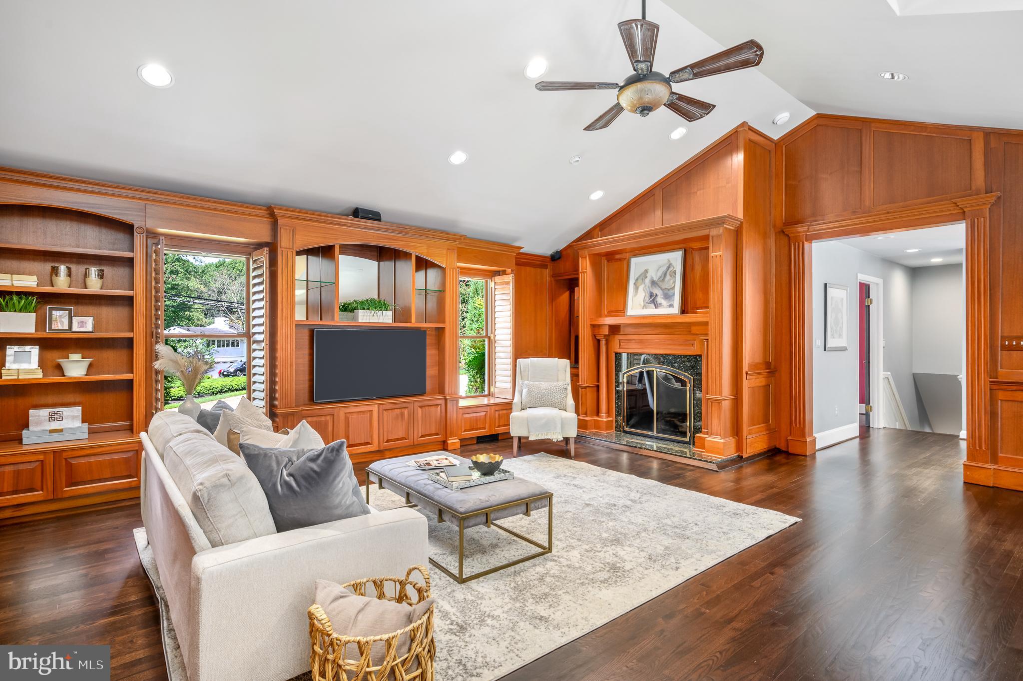 337 River Bend Road Great Falls, VA 22066 - Photo 26 of 92 Great room built in cabinets and gas fireplace