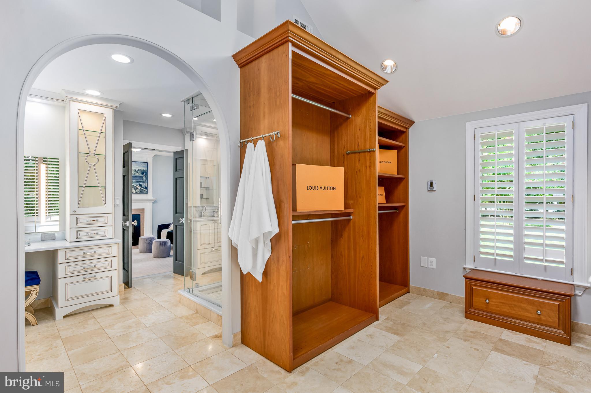337 River Bend Road Great Falls, VA 22066 - Photo 36 of 92 Large walk-in closet with custom shelving