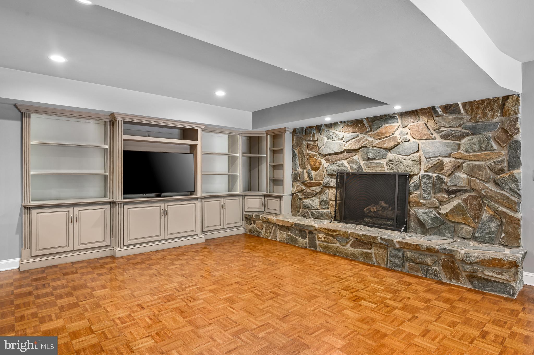 337 River Bend Road Great Falls, VA 22066 - Photo 51 of 92 Recreation room w/gas fireplace & built-in shelves