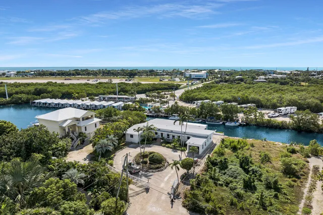 an aerial view of residential building and lake