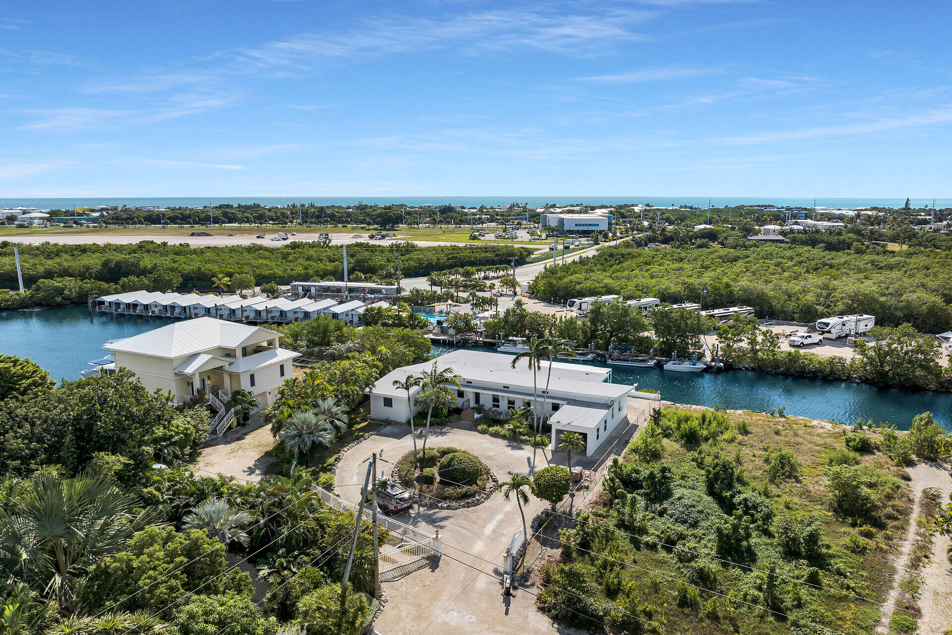 an aerial view of residential building and lake