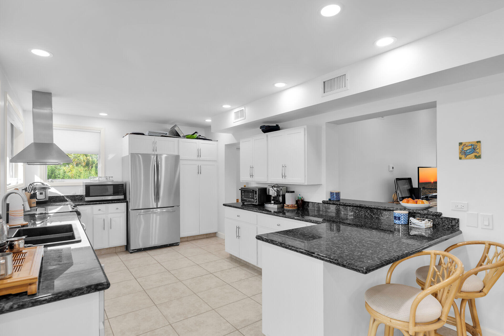 7501 Gulfstream Boulevard Marathon, FL 33050 - Photo 13 of 48 a kitchen with stainless steel appliances granite countertop a sink a stove and a refrigerator