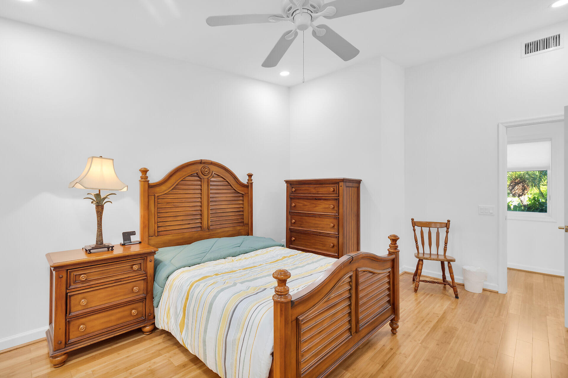 7501 Gulfstream Boulevard Marathon, FL 33050 - Photo 22 of 48 a bedroom with bed and a chandelier