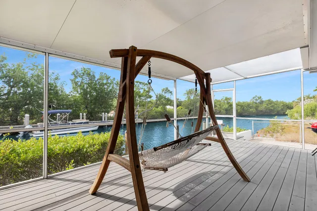 a view of a balcony with lake view and wooden floor