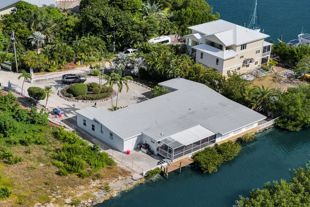 an aerial view of a house with outdoor space