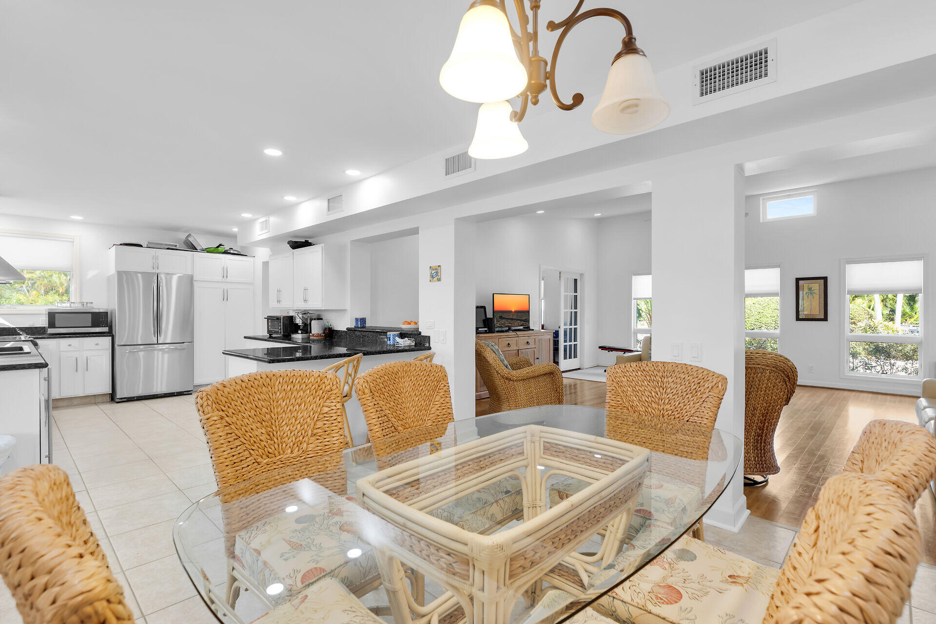 7501 Gulfstream Boulevard Marathon, FL 33050 - Photo 6 of 48 a living room with furniture kitchen view and a chandelier