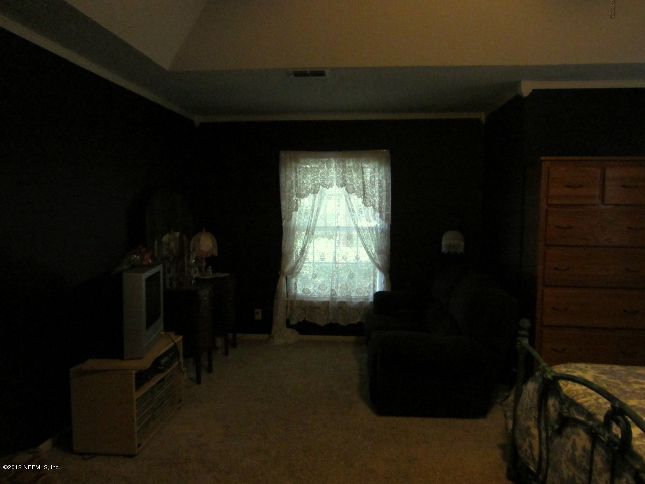 690 Roberts Road St. Johns, FL 32259 - Photo 18 of 32 a bed room with a bed and a window