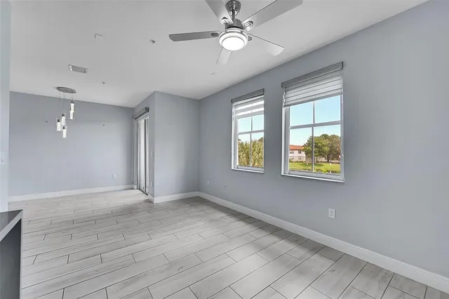 a view of an empty room with a window