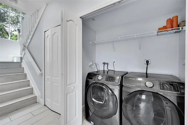 a view of a storage & utility room with stairs