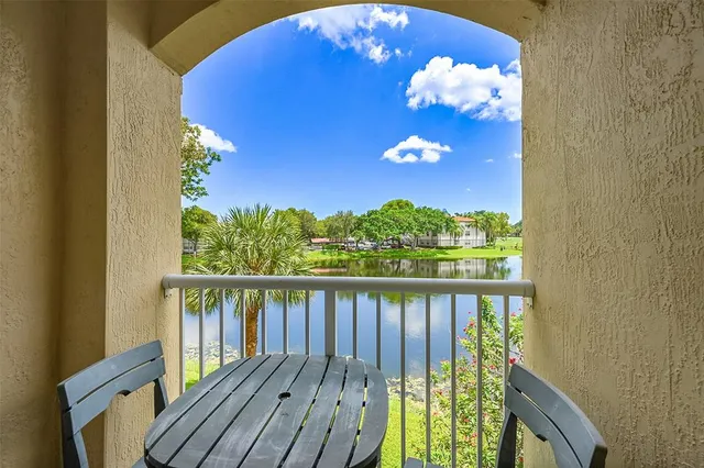 a view of a balcony with wooden floor