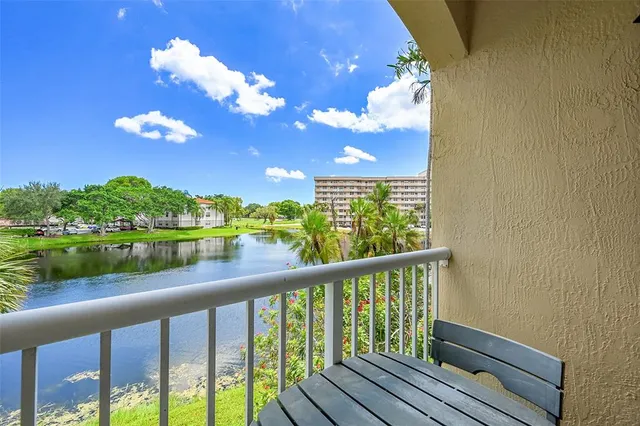 a view of a balcony with wooden floor